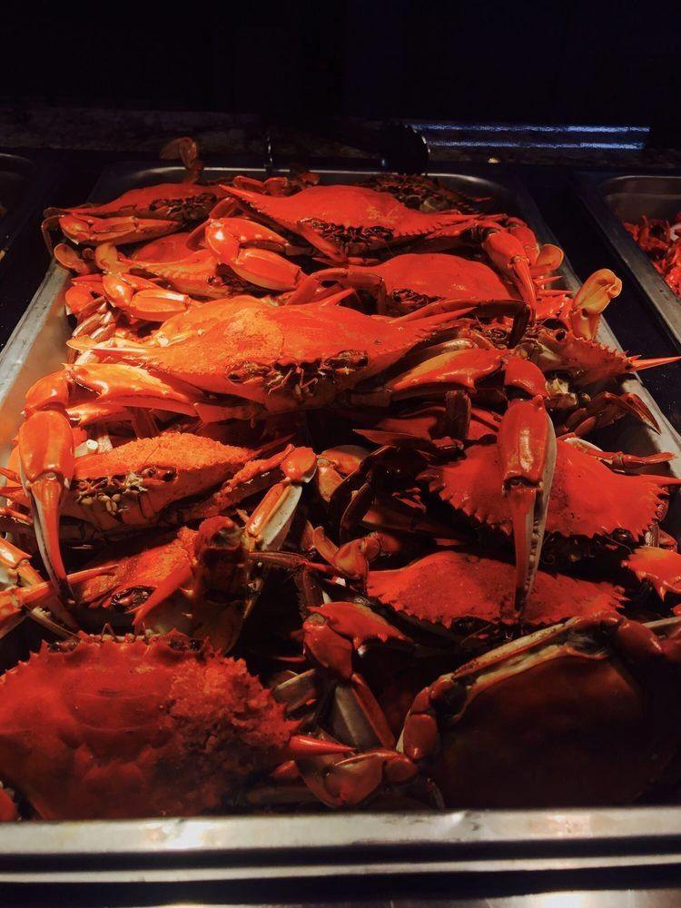 A tray of steamed blue crabs on the buffet