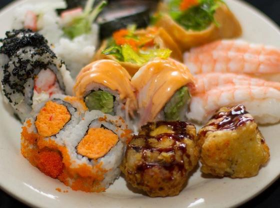 A plate of sushi rolls and nigiri